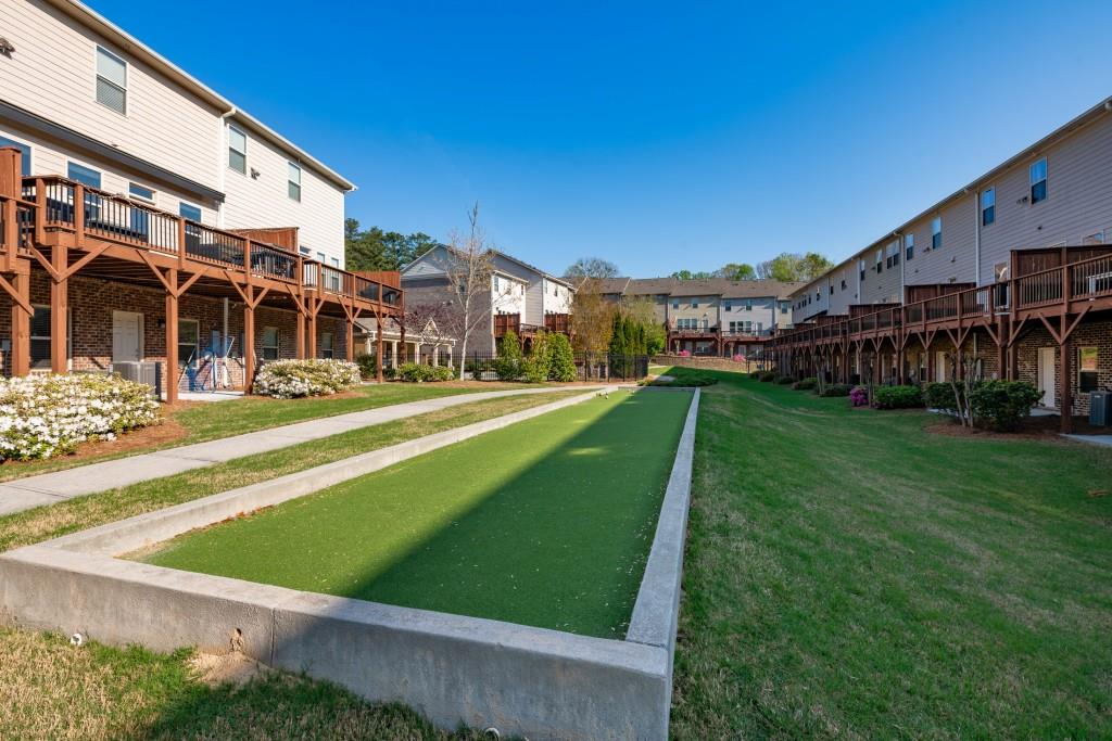 4062 Townsend Lane Atlanta, GA 30346 - Photo 39 of 52 a view of a big building with a big yard and plants