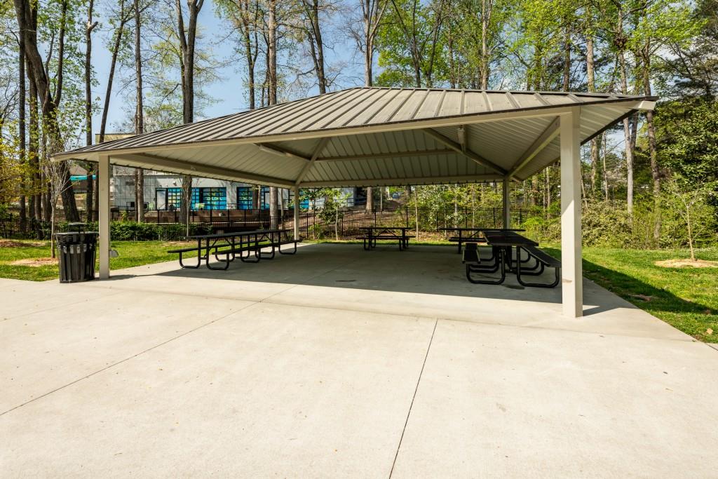 4062 Townsend Lane Atlanta, GA 30346 - Photo 48 of 52 a view of patio with a table and chairs under an umbrella