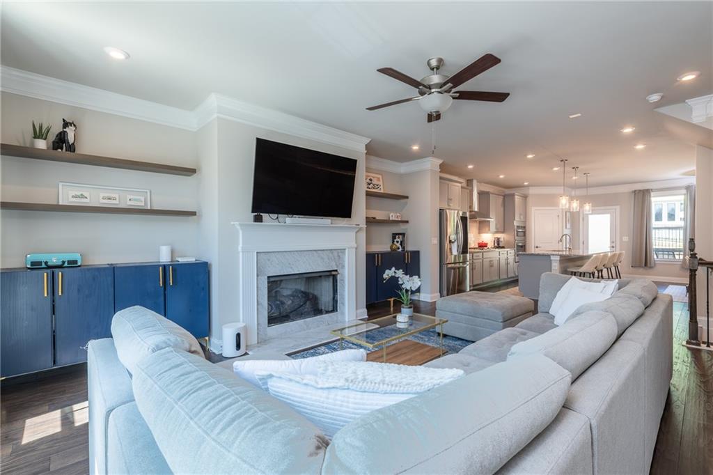 4062 Townsend Lane Atlanta, GA 30346 - Photo 6 of 52 a living room with furniture a fireplace and a flat screen tv