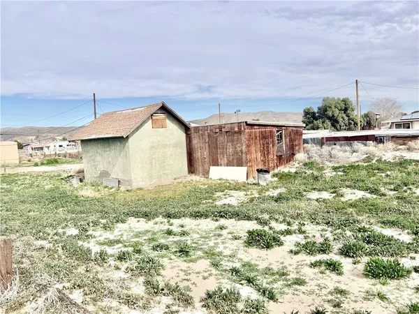 a view of a house with a yard and plants