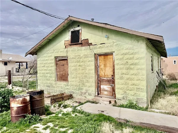 a front view of a house with outdoor space