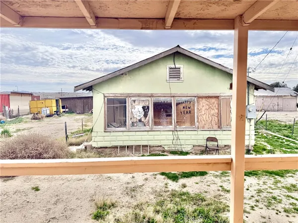 a view of swimming pool with the back yard
