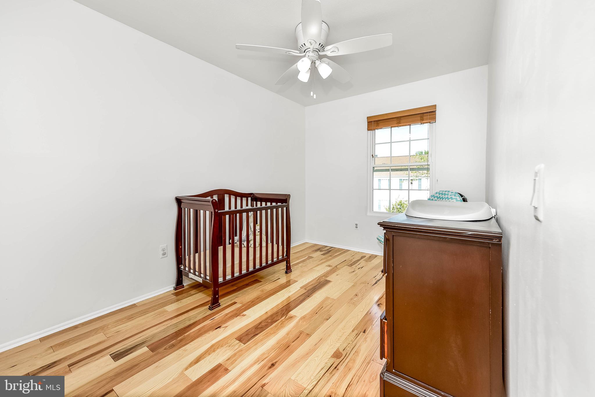 129 Fort Evans Road Southeast, Unit E Leesburg, VA 20175 - Photo 11 of 20 Neutral paint and ceiling fans in both bedrooms