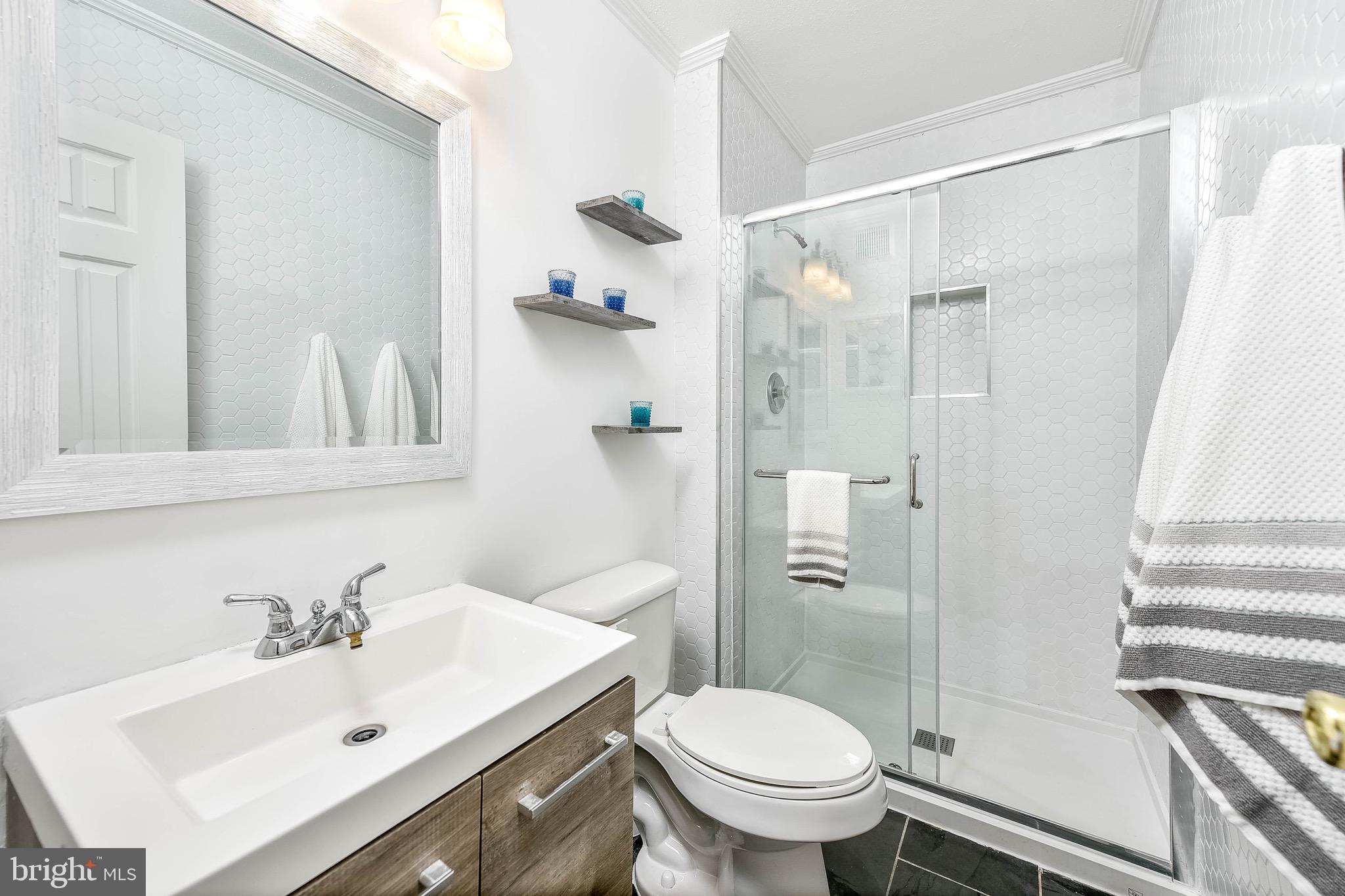 129 Fort Evans Road Southeast, Unit E Leesburg, VA 20175 - Photo 12 of 20 Full guest bathroom glistens with updates