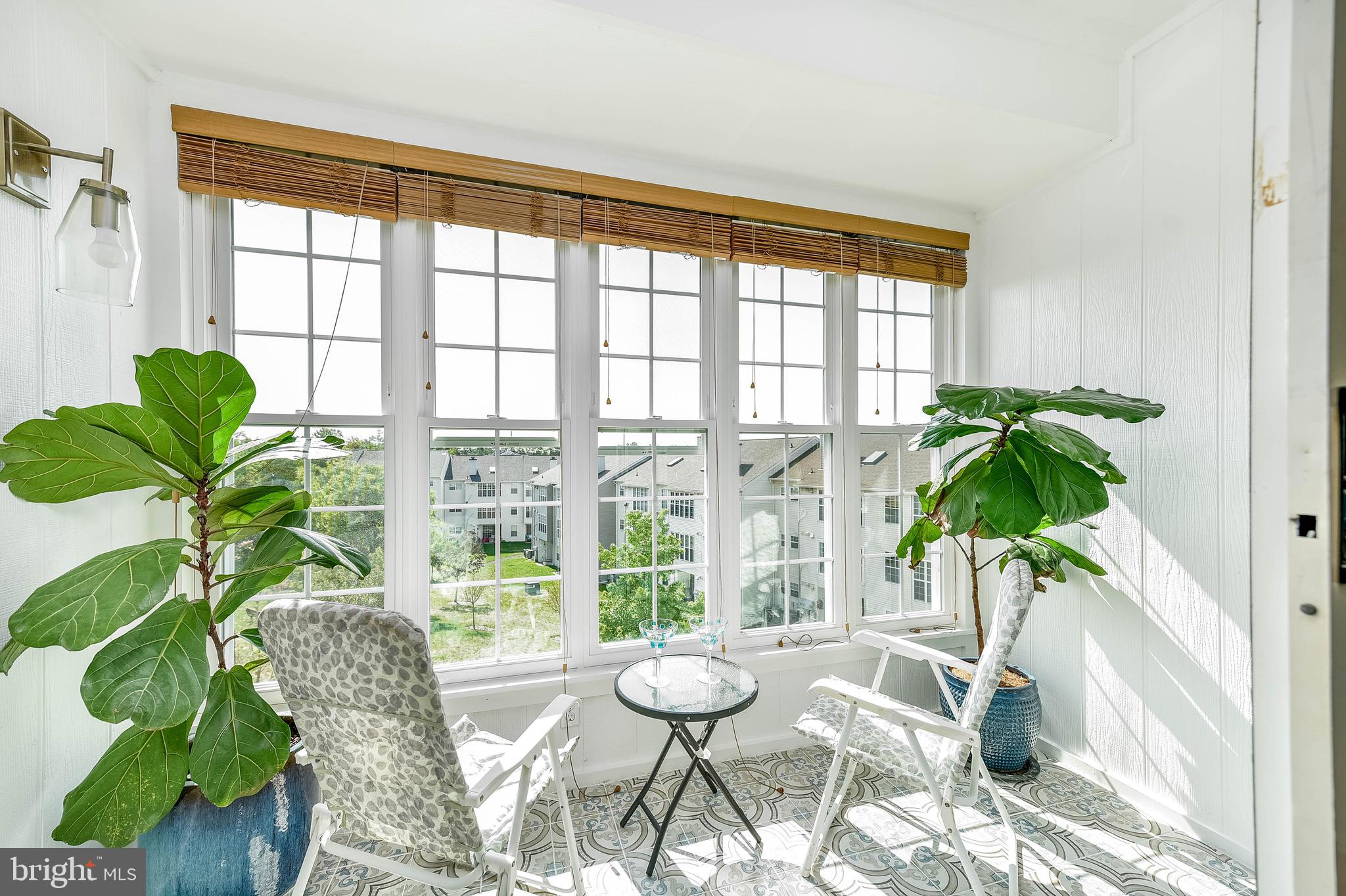 129 Fort Evans Road Southeast, Unit E Leesburg, VA 20175 - Photo 5 of 20 Bright, cheery solarium with view of common area
