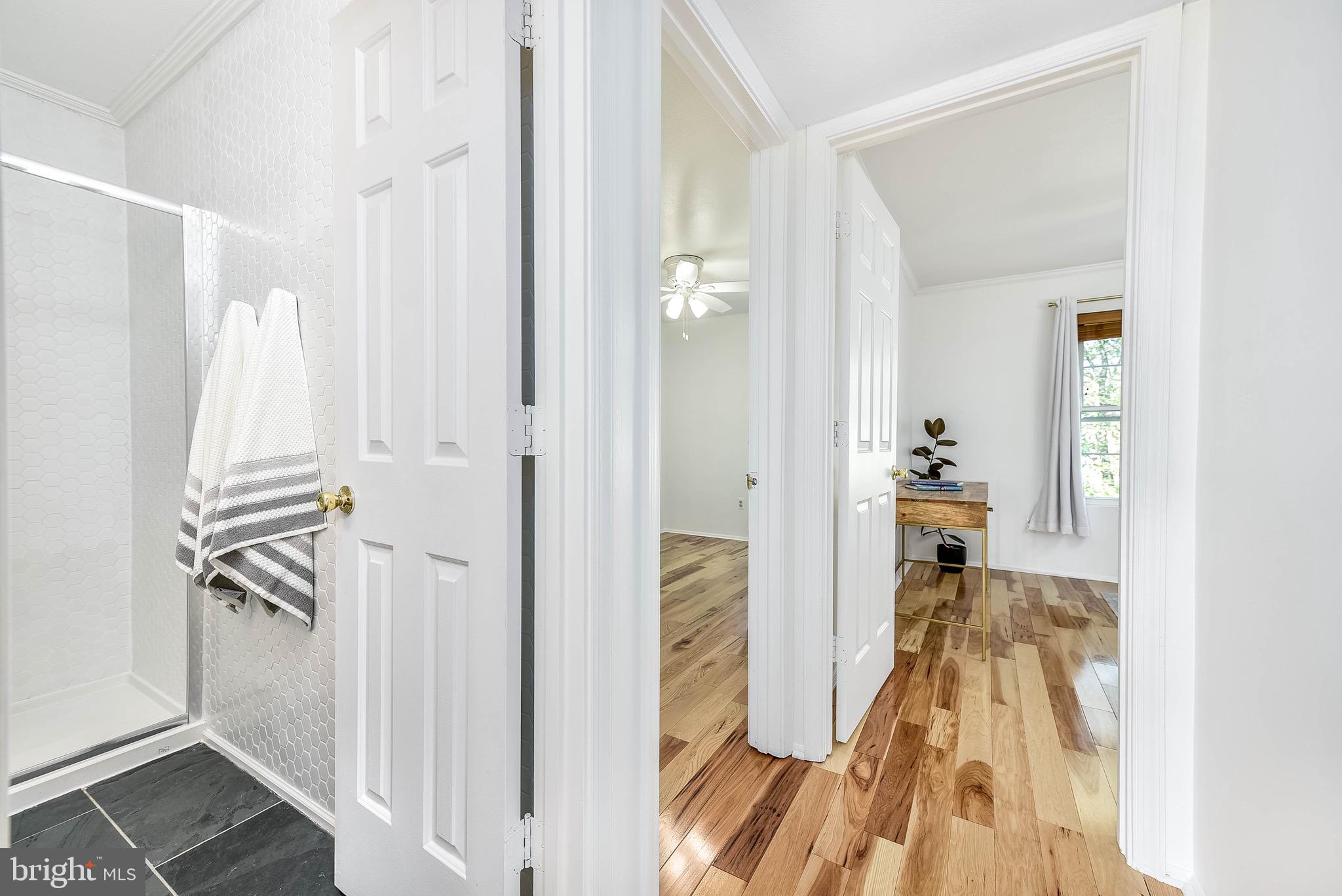 129 Fort Evans Road Southeast, Unit E Leesburg, VA 20175 - Photo 7 of 20 Hallway leads to guest bathroom and 2 bedrooms