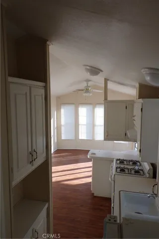 a kitchen with stainless steel appliances a stove and a refrigerator