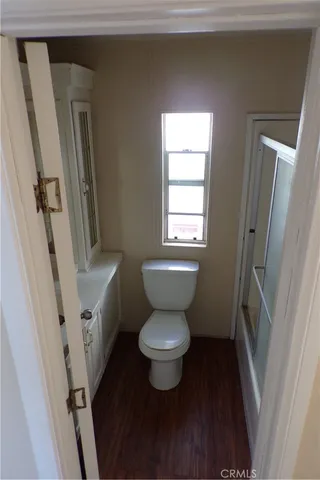 a bathroom with a toilet and a sink