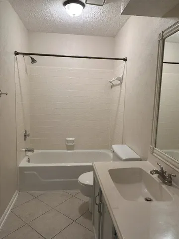 a bathroom with a sink a toilet and a bathtub