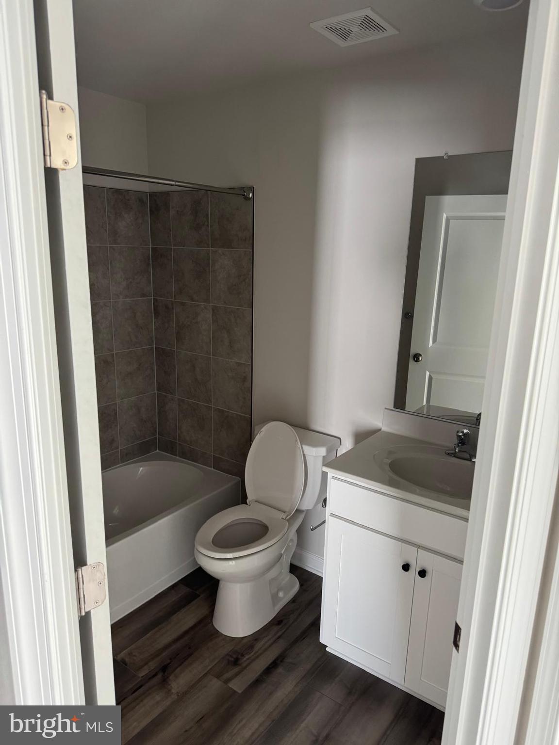 1257 Cedar Vly Road Ranson, WV 25438 - Photo 10 of 13 a bathroom with a granite countertop sink toilet and shower