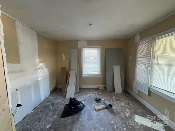 a room with a window wooden floor and a window
