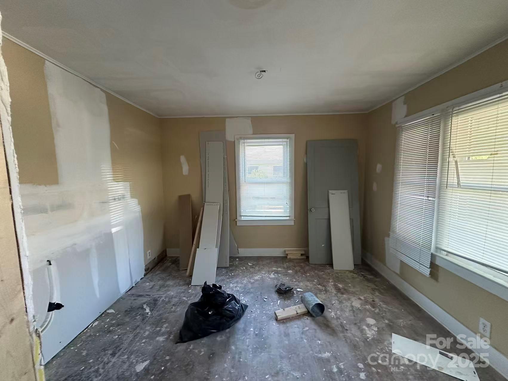 112 East Elliott Street Fort Mill, SC 29715 - Photo 3 of 8 a room with a window wooden floor and a window