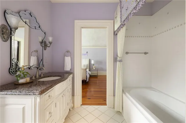 a view of a house with a yard and potted plants