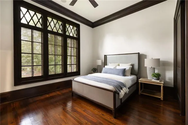 a bathroom with a granite countertop sink a mirror and shower