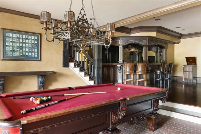 a bathroom with a granite countertop sink toilet a mirror and shower