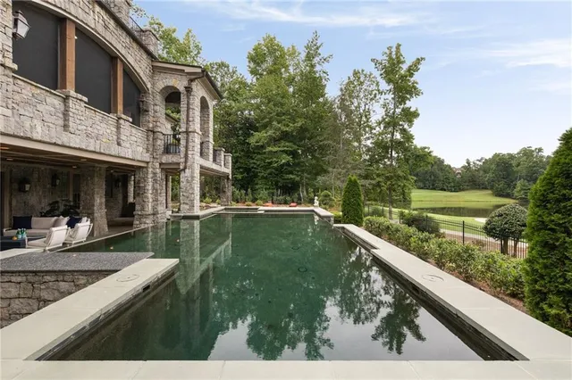 an aerial view of a house with outdoor space