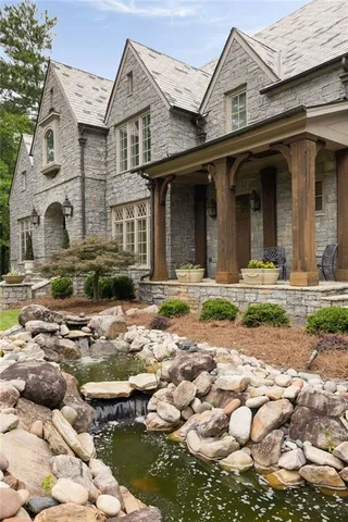 an aerial view of a house with yard swimming pool and outdoor seating