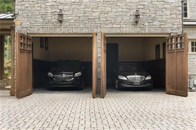 an aerial view of a house with a yard and trees