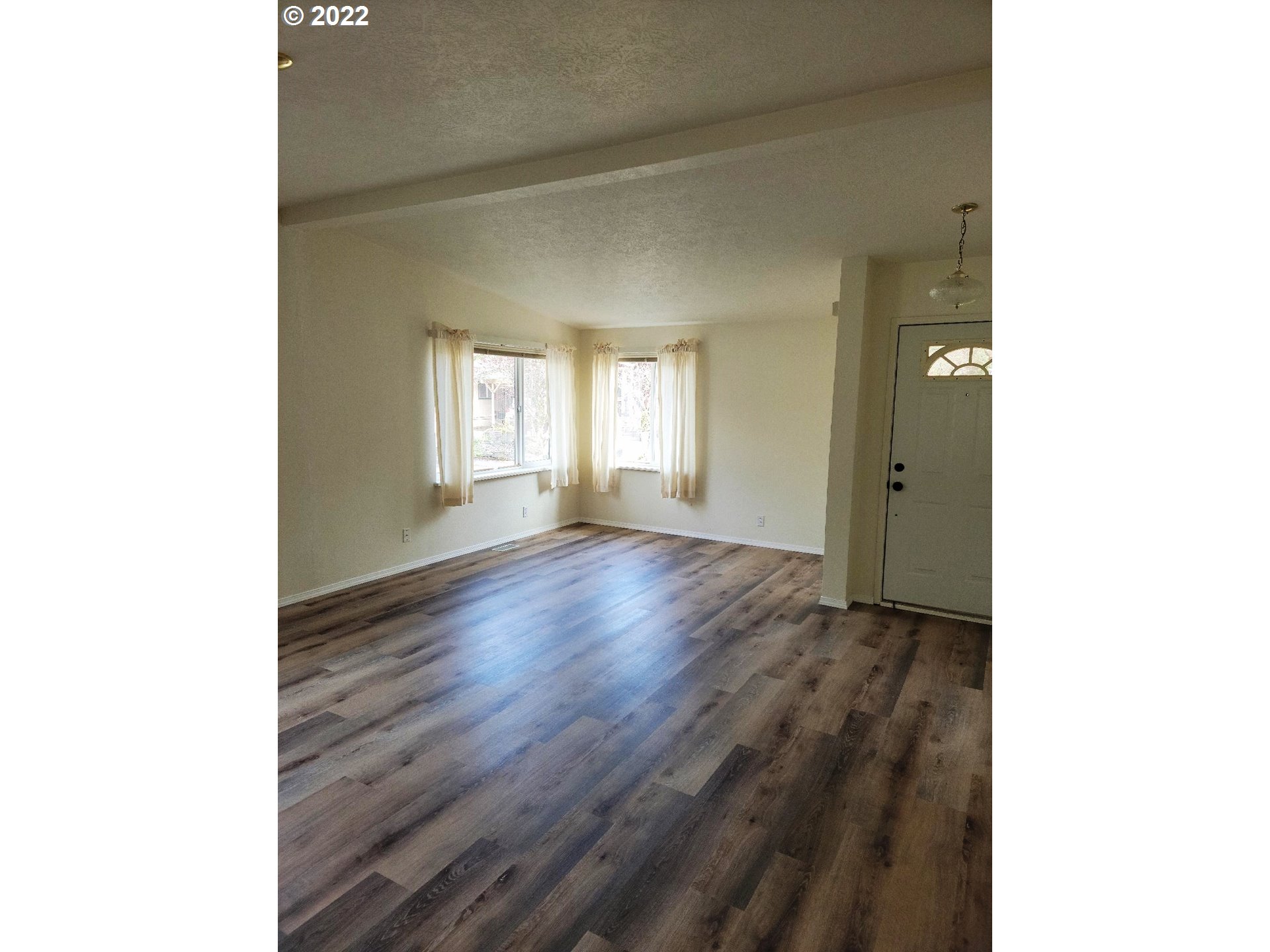 25222 East Welches Road, Unit 8 Welches, OR 97067 - Photo 11 of 31 a view of an empty room and window