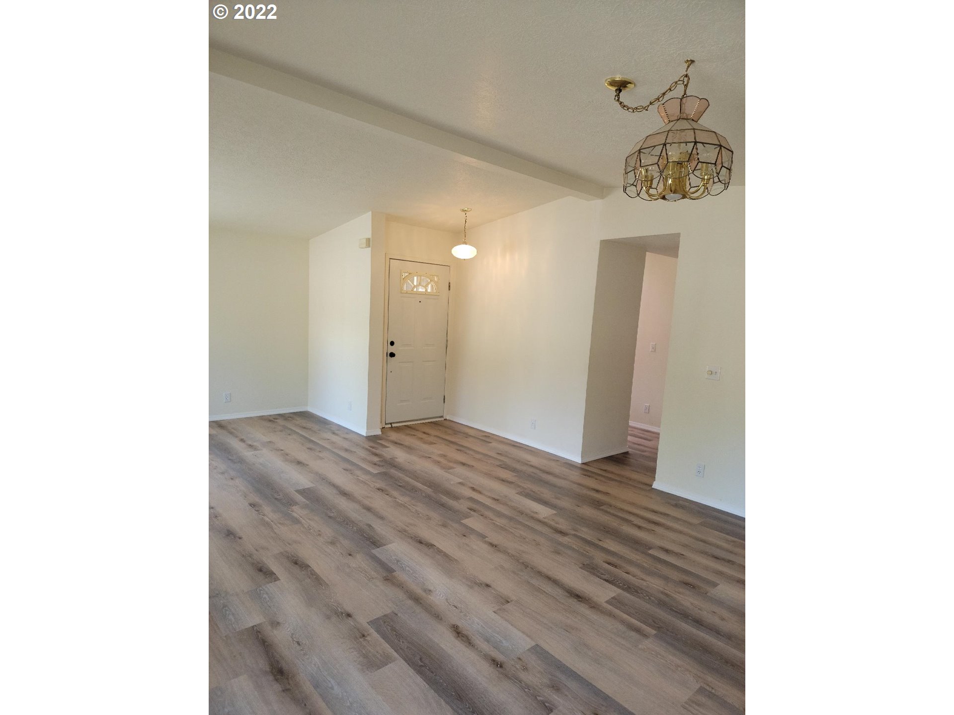 25222 East Welches Road, Unit 8 Welches, OR 97067 - Photo 12 of 31 a view of a hallway with wooden floor