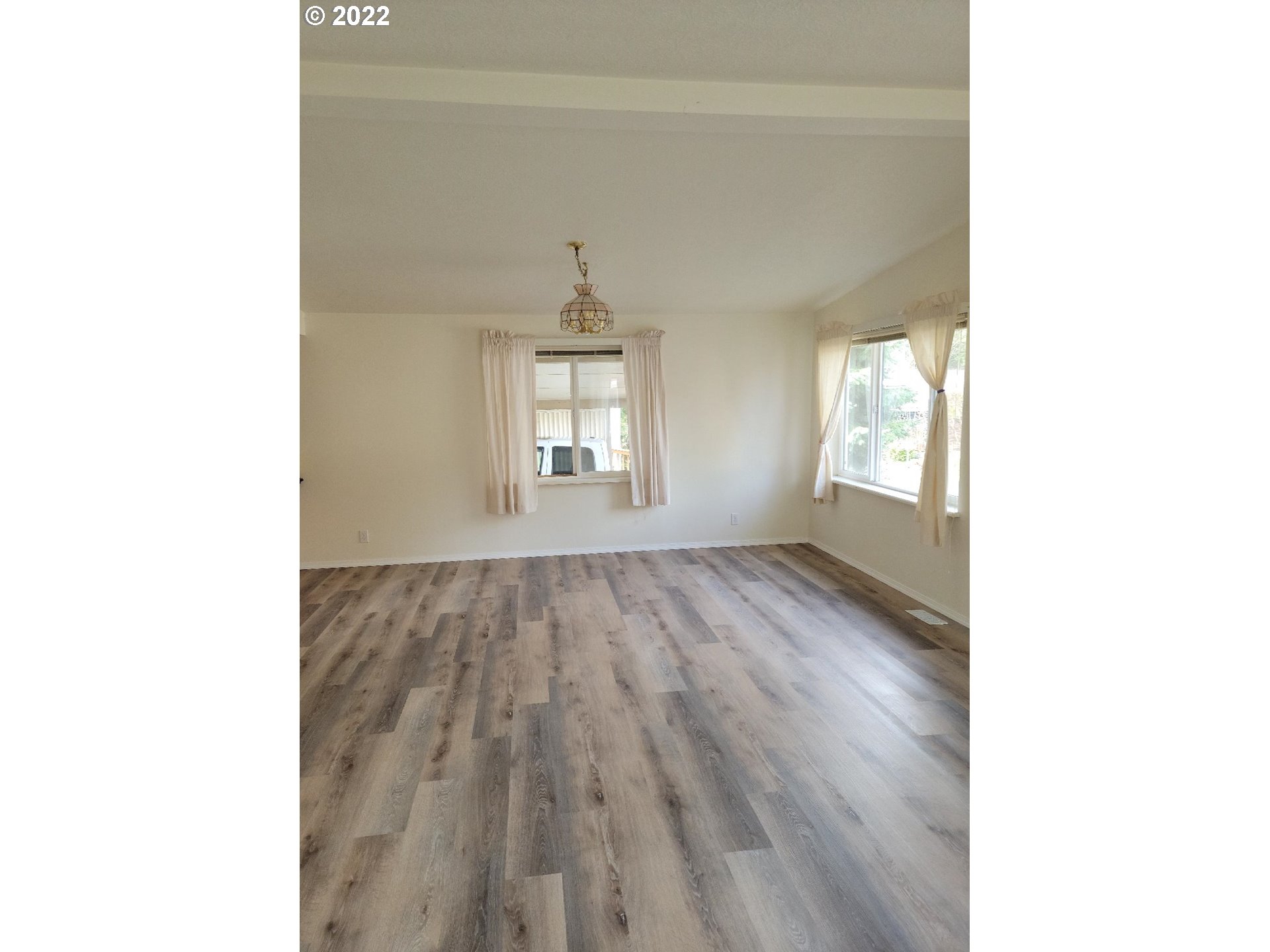 25222 East Welches Road, Unit 8 Welches, OR 97067 - Photo 13 of 31 a view of an empty room and window