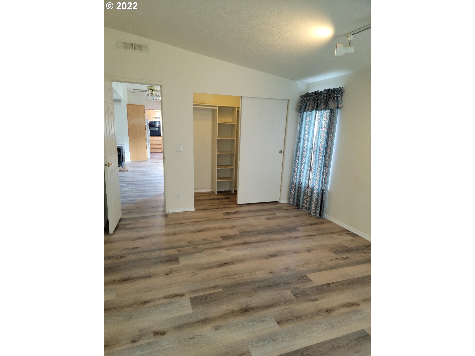 25222 East Welches Road, Unit 8 Welches, OR 97067 - Photo 14 of 31 a view of a hallway with wooden floor