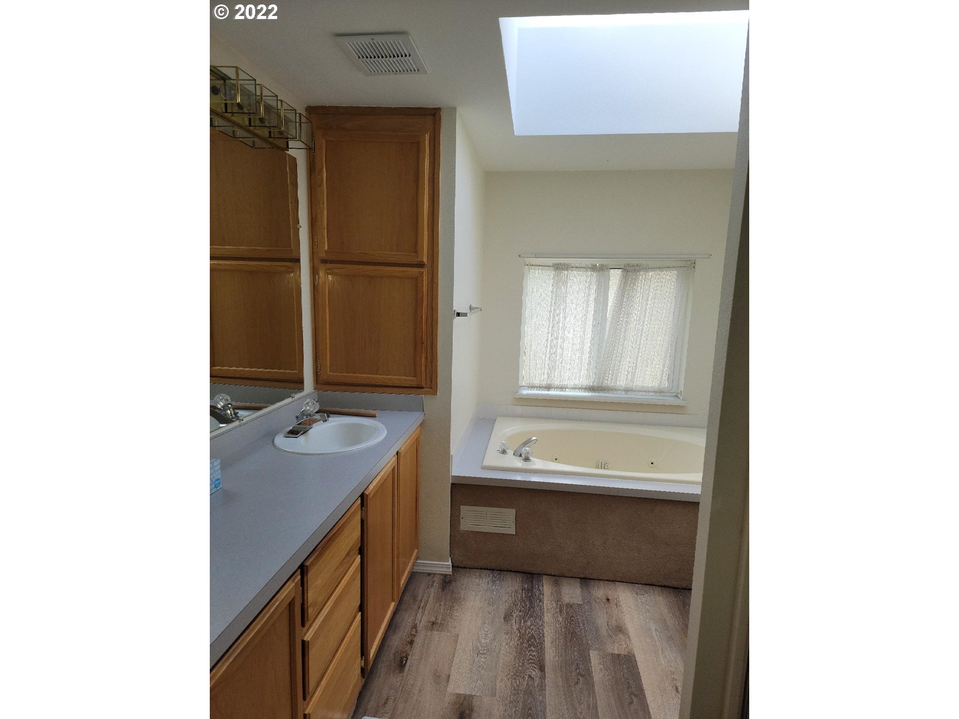 25222 East Welches Road, Unit 8 Welches, OR 97067 - Photo 15 of 31 a bathroom with a tub sink and mirror