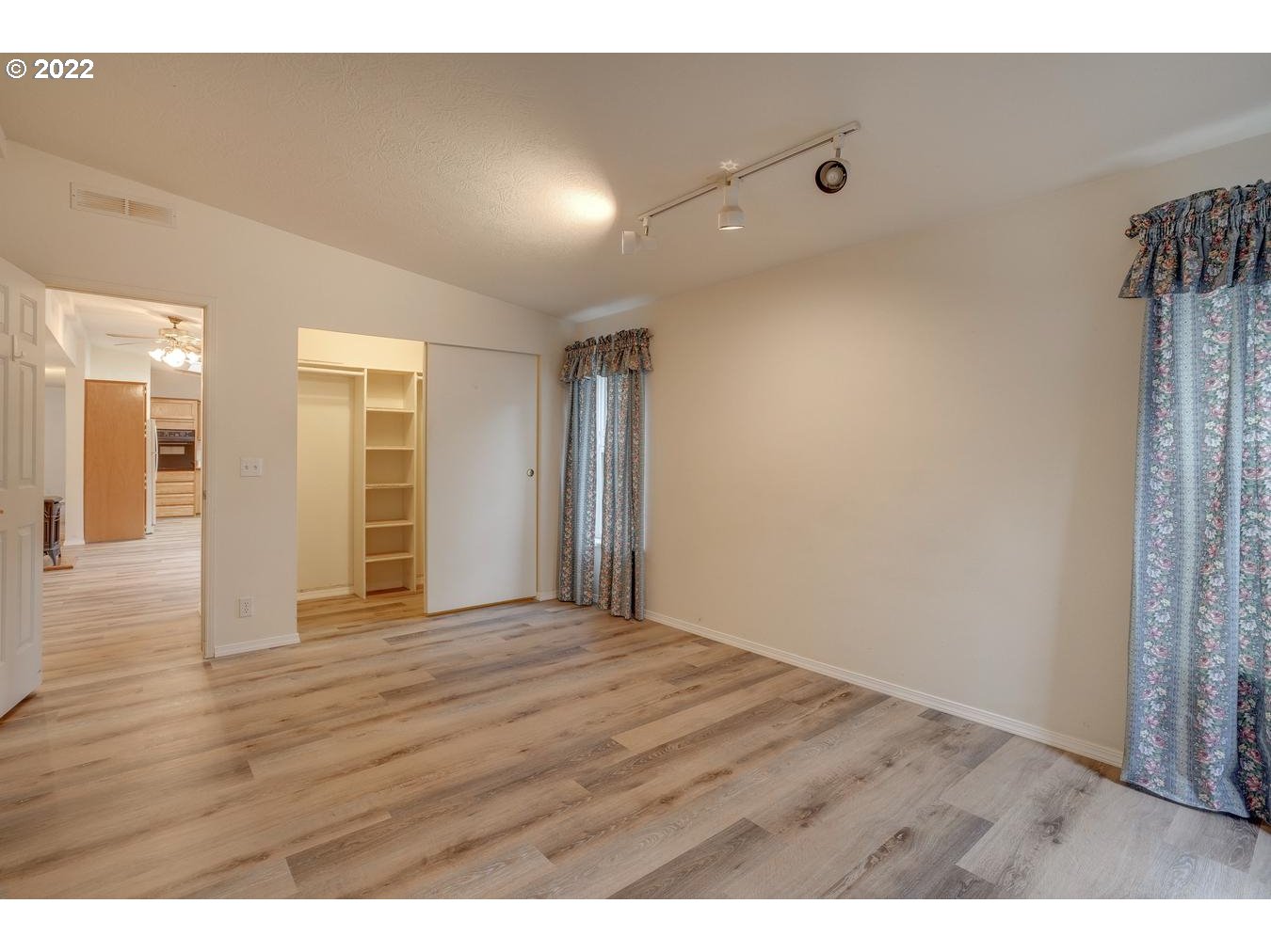 25222 East Welches Road, Unit 8 Welches, OR 97067 - Photo 19 of 31 a view of an empty room with wooden floor