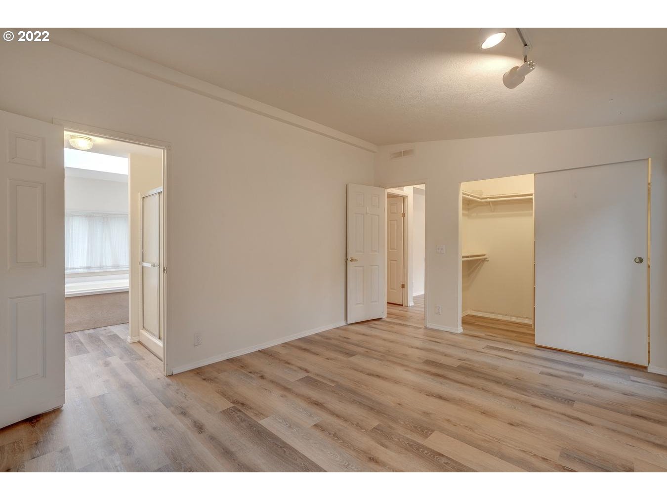 25222 East Welches Road, Unit 8 Welches, OR 97067 - Photo 20 of 31 a view of an empty room and wooden floor