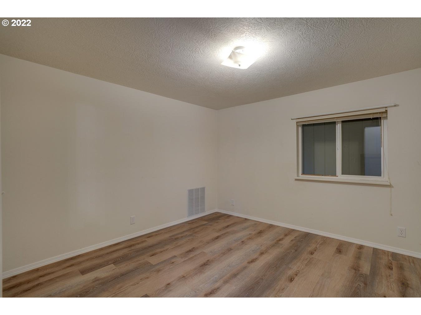 25222 East Welches Road, Unit 8 Welches, OR 97067 - Photo 21 of 31 a view of an empty room and window