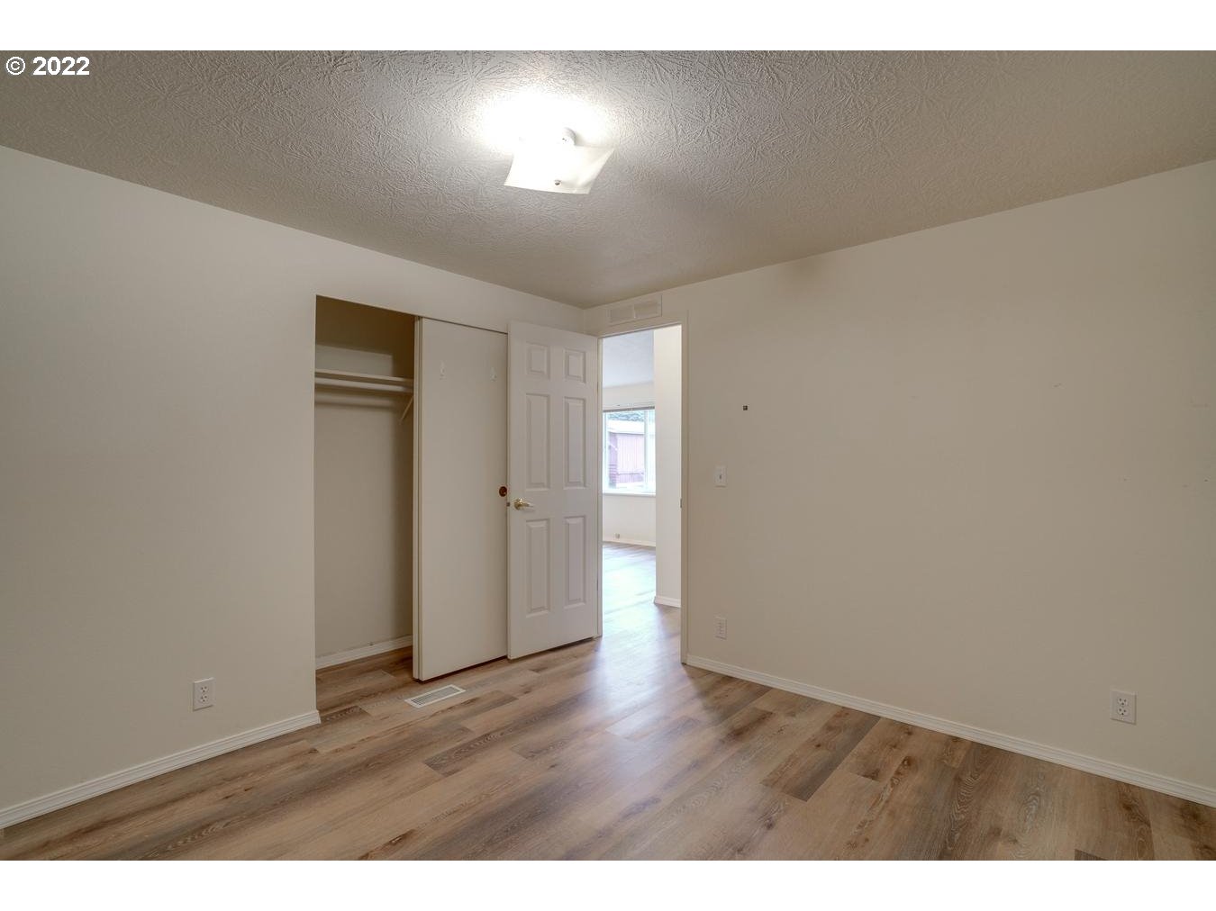 25222 East Welches Road, Unit 8 Welches, OR 97067 - Photo 22 of 31 a view of an empty room and wooden floor