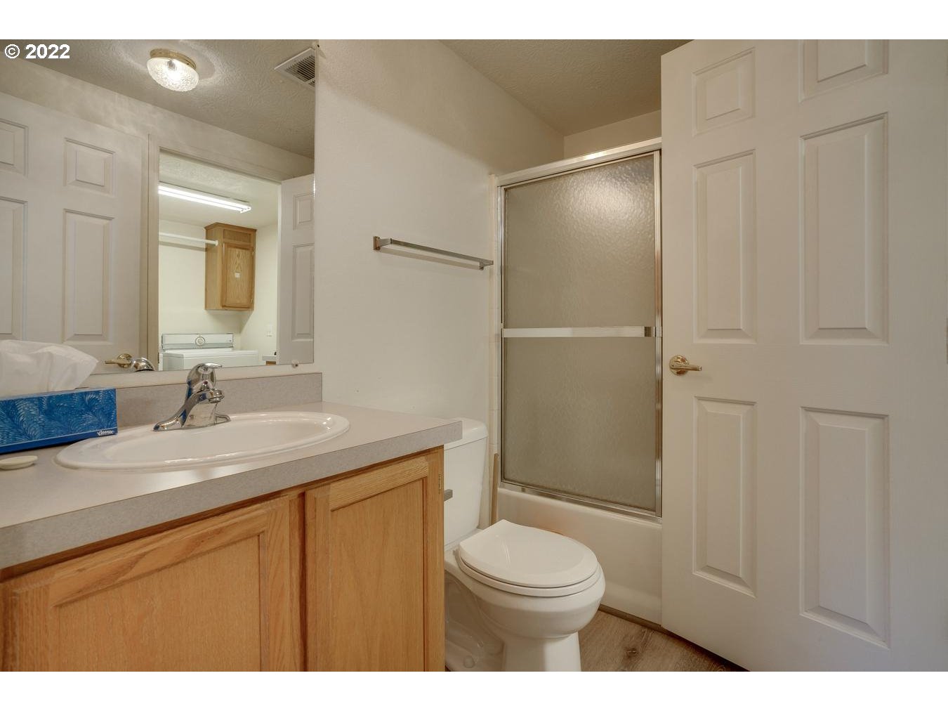 25222 East Welches Road, Unit 8 Welches, OR 97067 - Photo 26 of 31 a bathroom with a granite countertop sink toilet a mirror and shower