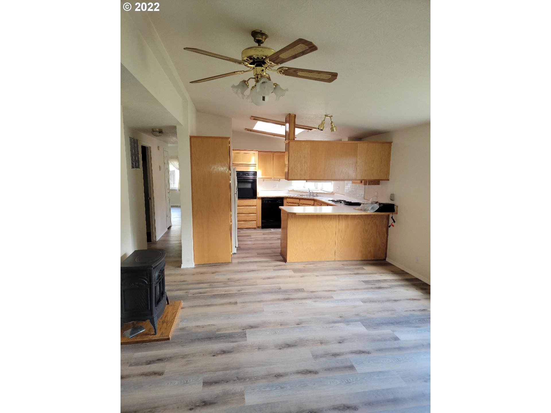 25222 East Welches Road, Unit 8 Welches, OR 97067 - Photo 5 of 31 a view of a kitchen with a sink and a refrigerator