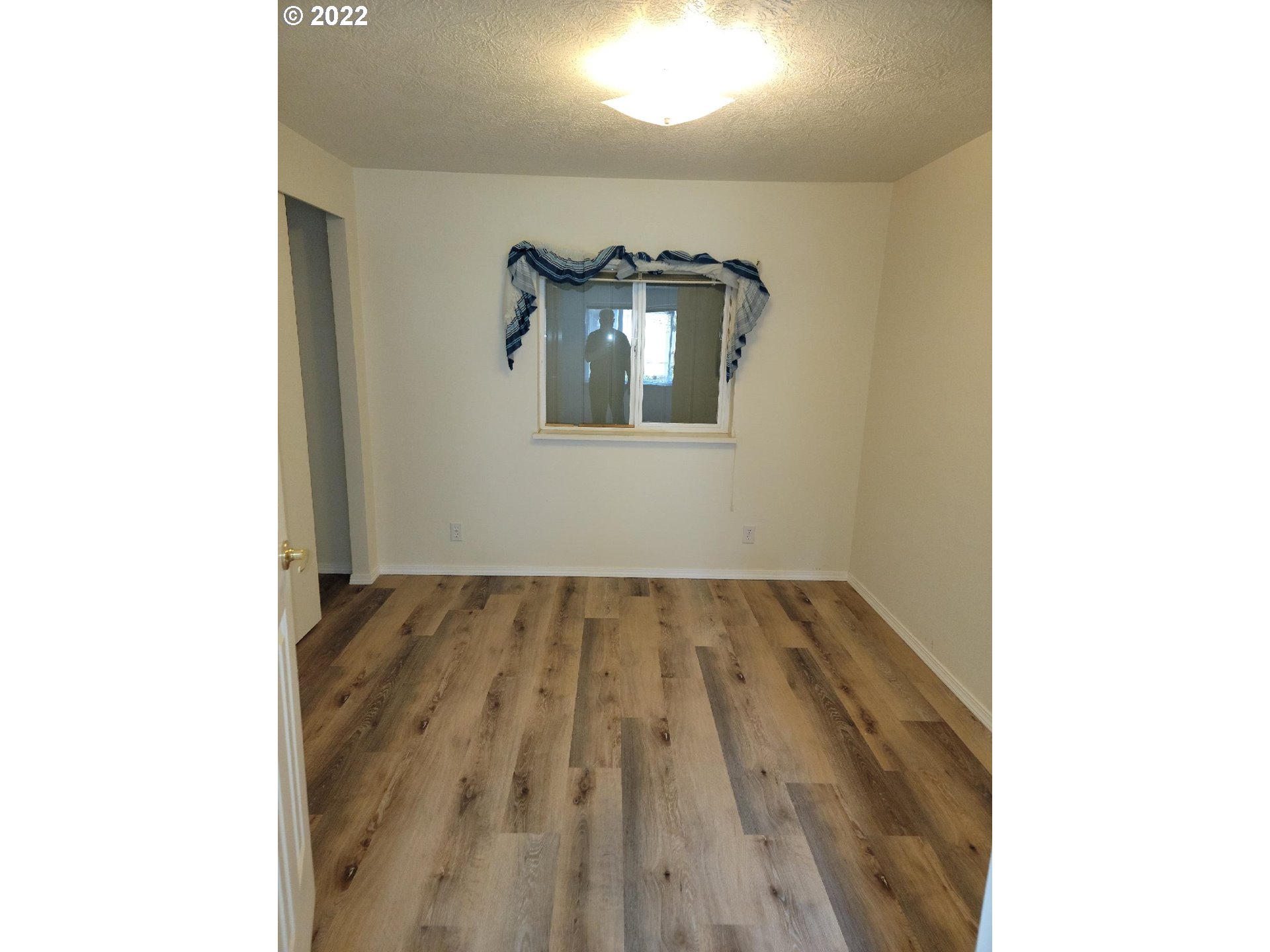25222 East Welches Road, Unit 8 Welches, OR 97067 - Photo 8 of 31 a view of hallway with wooden floor