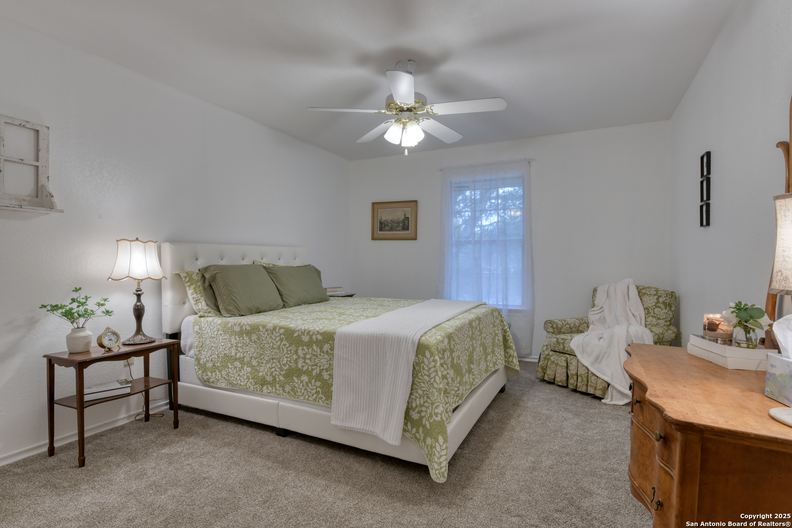 510 Rudeloff Road Seguin, TX 78155 - Photo 38 of 54 a bedroom with a bed and a chandelier