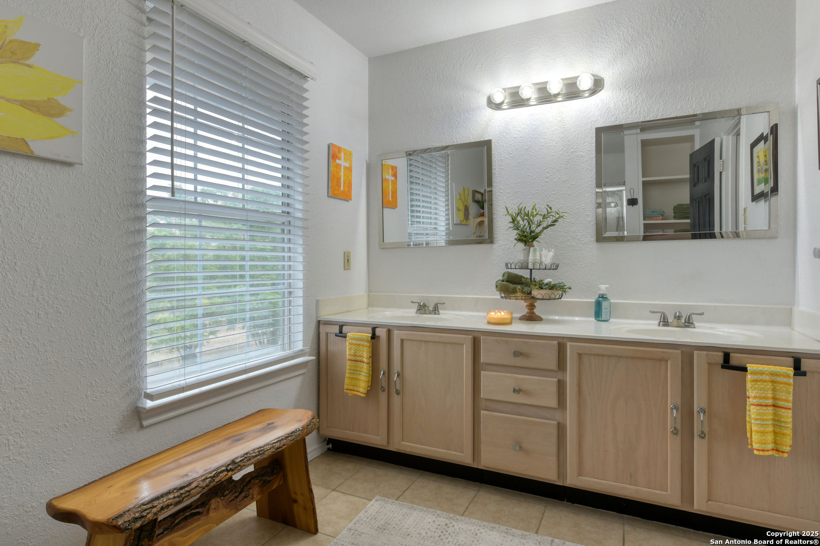 510 Rudeloff Road Seguin, TX 78155 - Photo 41 of 54 a spacious bathroom with a double vanity sink a mirror and a bathtub
