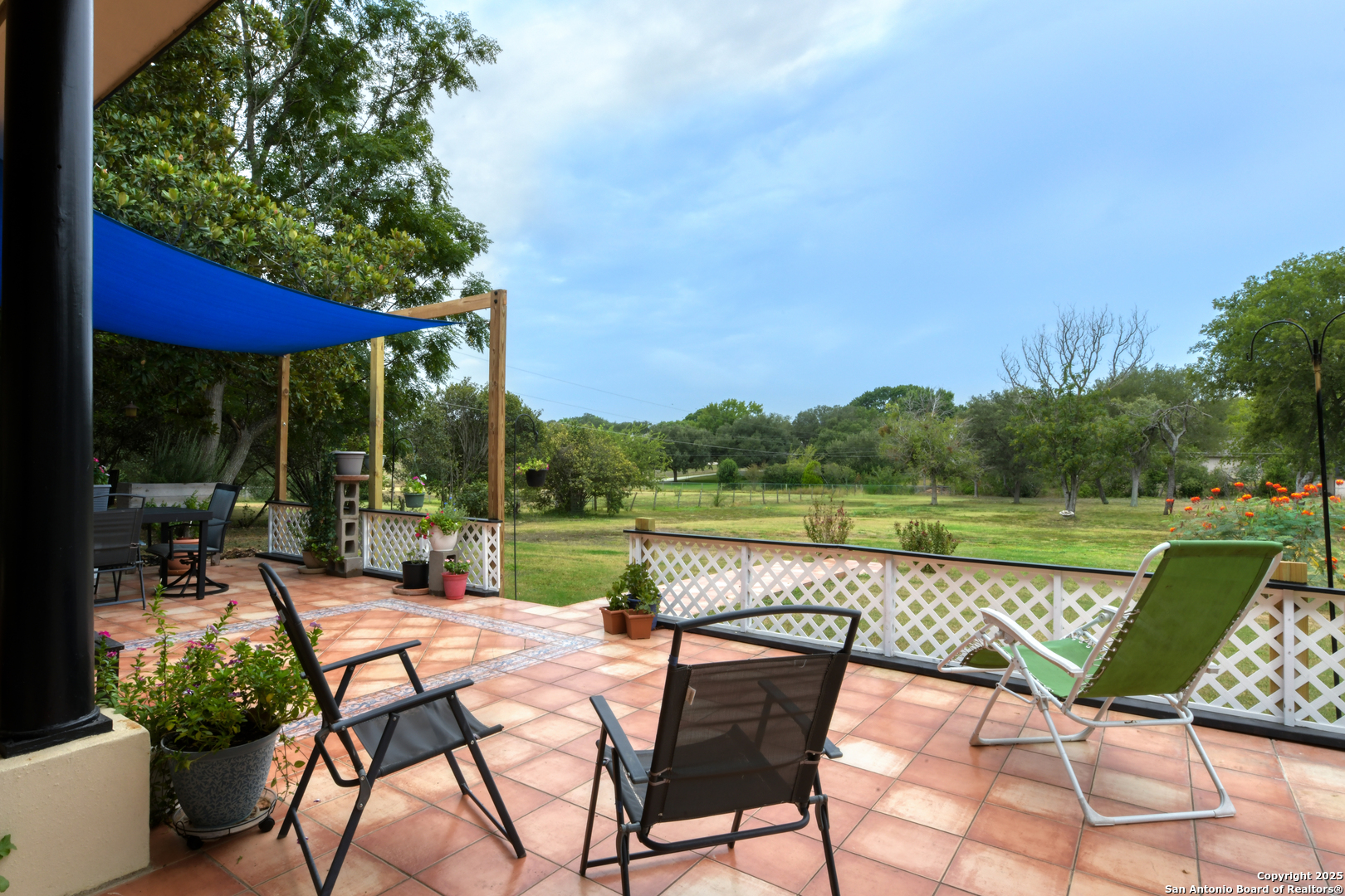 510 Rudeloff Road Seguin, TX 78155 - Photo 47 of 54 a view of a lake with table and chairs under an umbrella