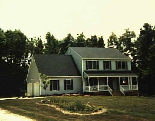 118 Taylor Road New Milford, CT 06776 - Photo 1 of 1 a front view of house with yard and trees in the background