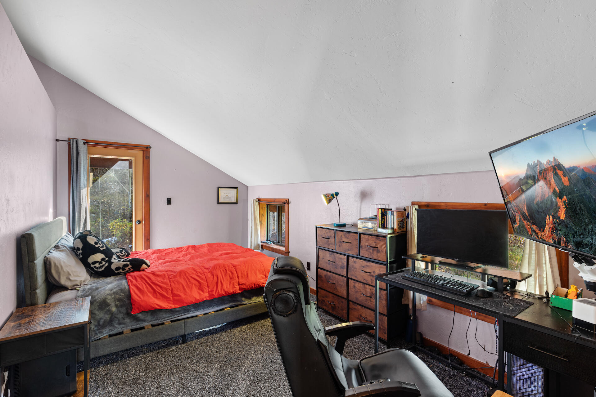 15 South Garfield Street Rico, CO 81332 - Photo 22 of 43 a bedroom with a bed and a flat screen tv