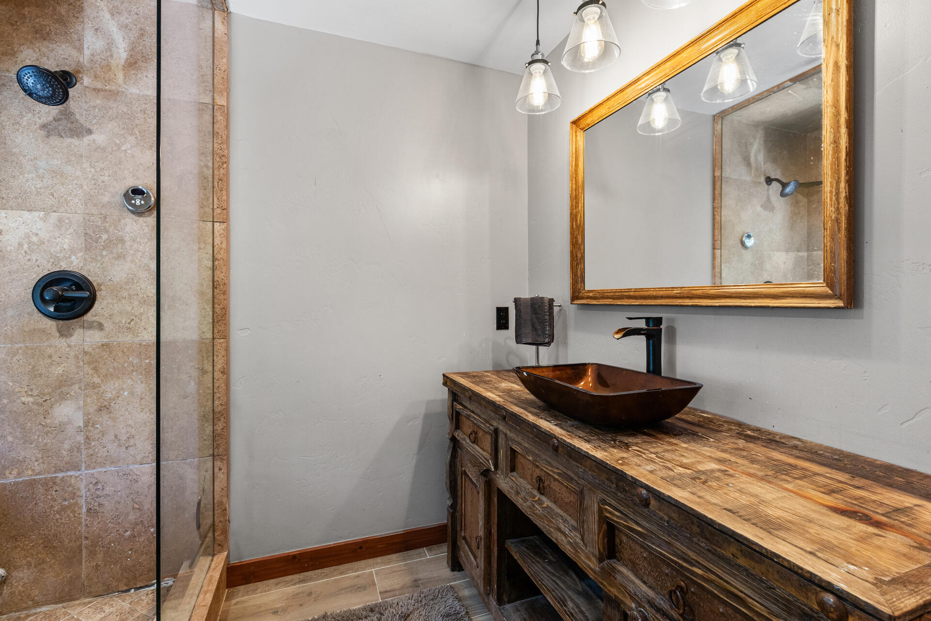 15 South Garfield Street Rico, CO 81332 - Photo 28 of 43 a bathroom with a granite countertop sink a mirror and shower