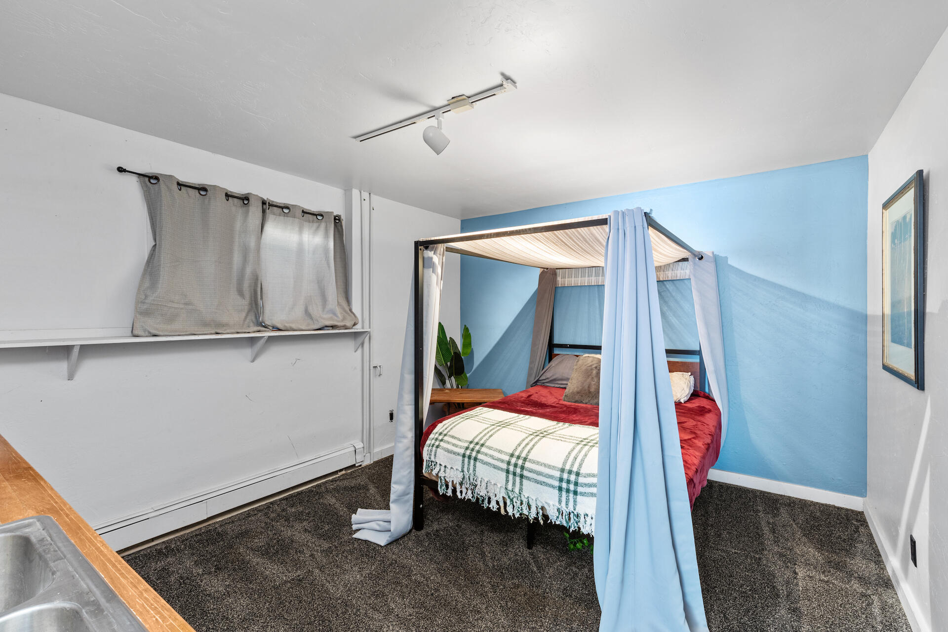 15 South Garfield Street Rico, CO 81332 - Photo 29 of 43 a bedroom with a bed and a mirror