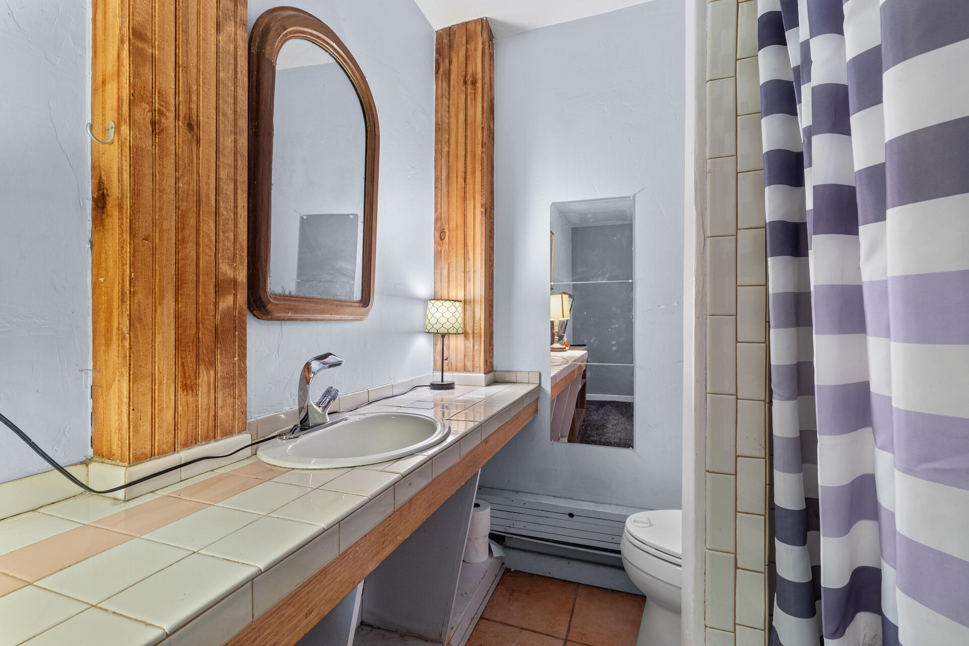 15 South Garfield Street Rico, CO 81332 - Photo 31 of 43 a bathroom with a granite countertop sink mirror vanity and toilet