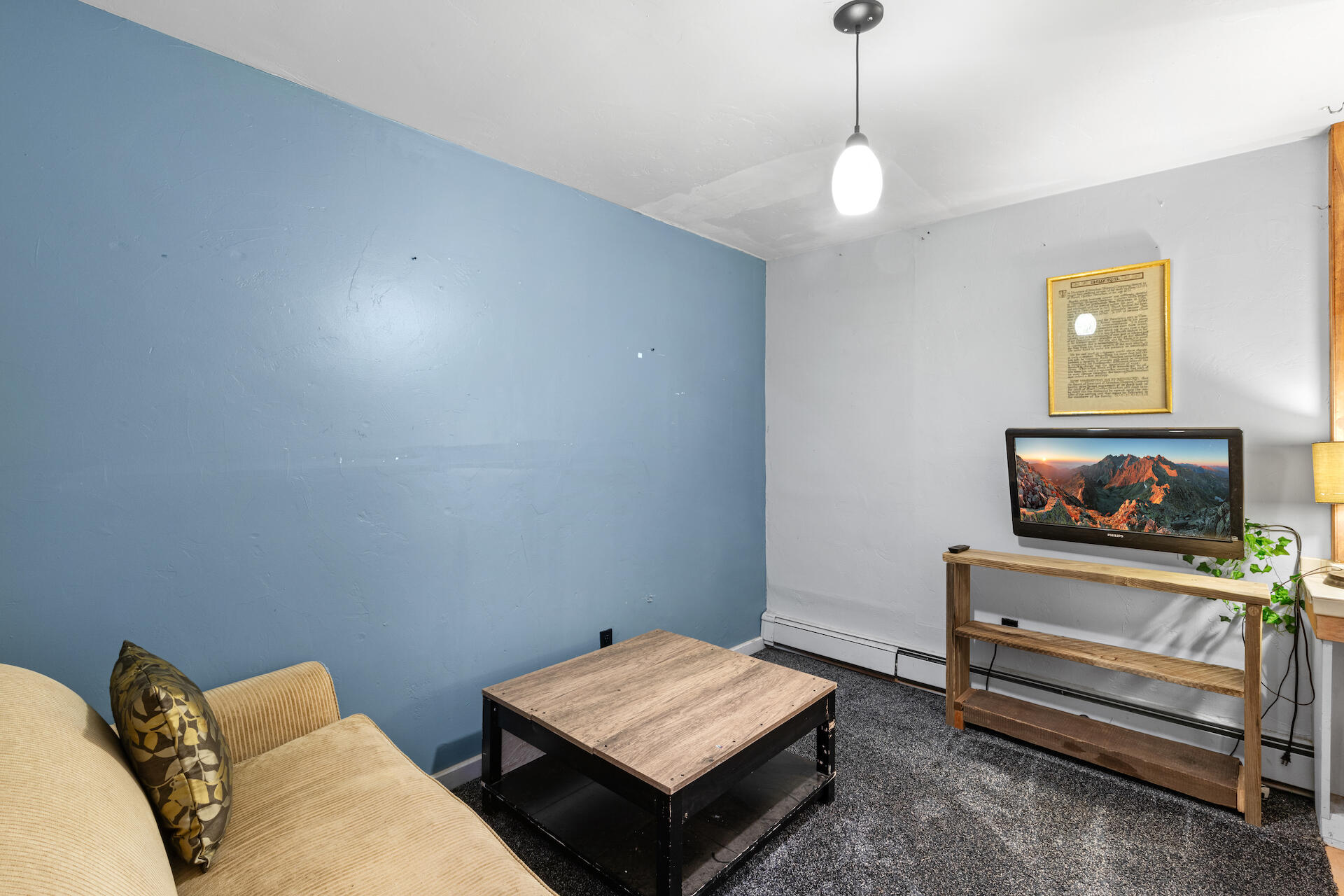 15 South Garfield Street Rico, CO 81332 - Photo 32 of 43 a living room with furniture and a flat screen tv