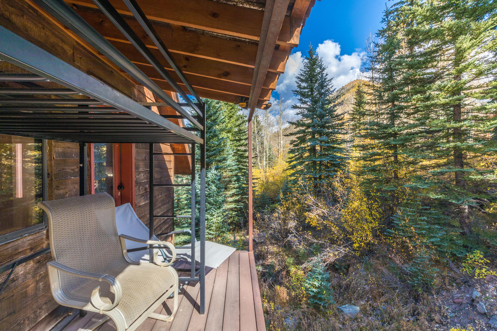 15 South Garfield Street Rico, CO 81332 - Photo 36 of 43 a view of a porch with chairs and potted plants