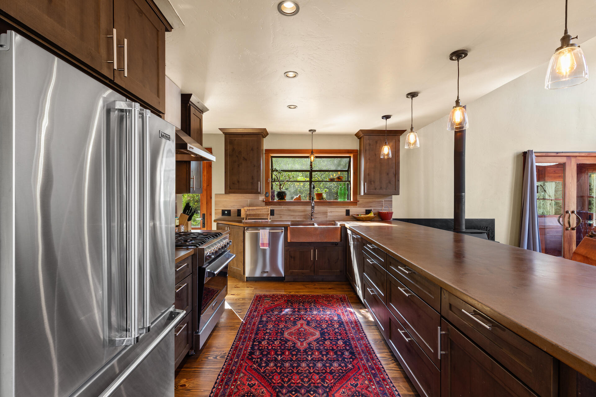 15 South Garfield Street Rico, CO 81332 - Photo 7 of 43 a large kitchen with lots of counter space and stainless steel appliances