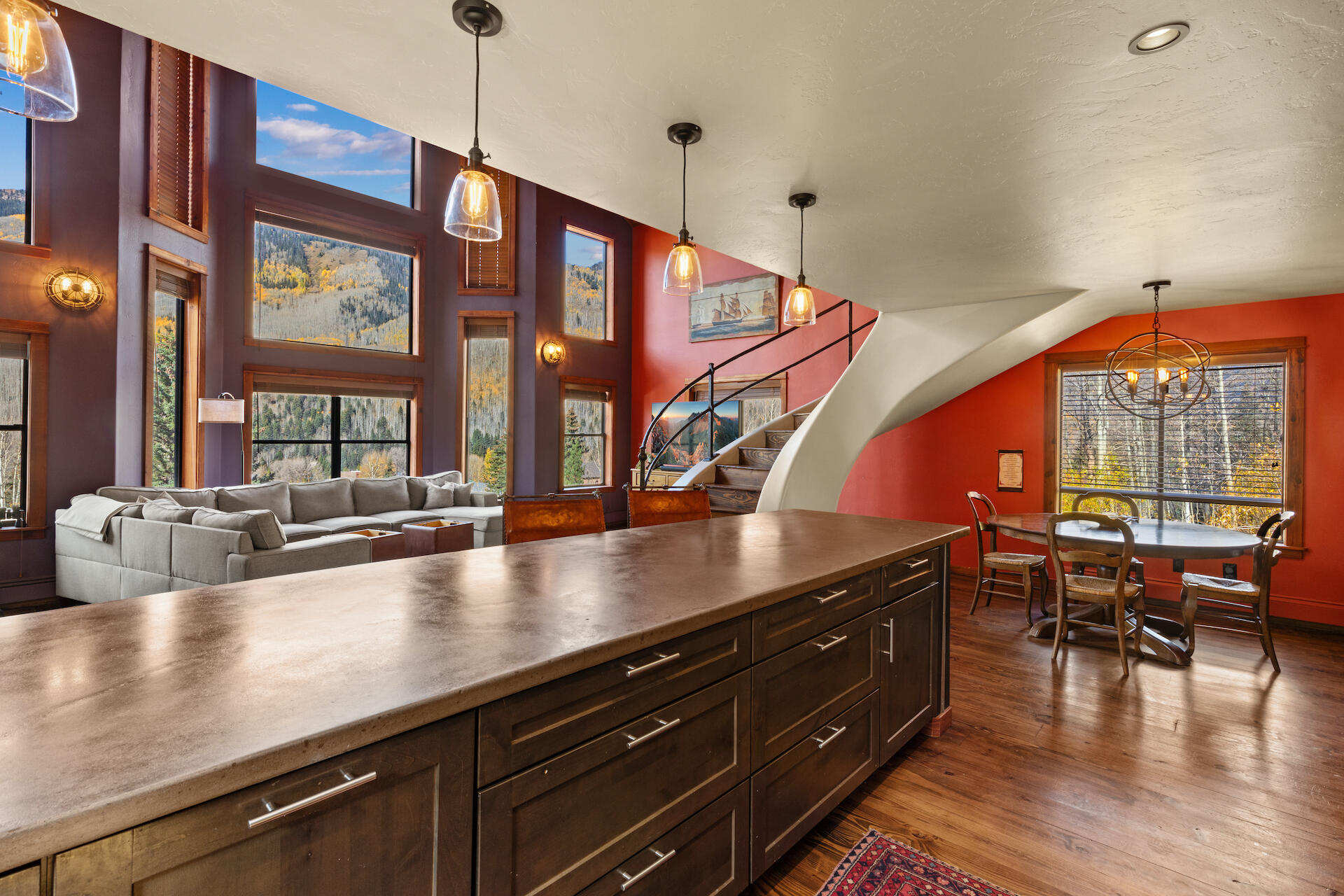 15 South Garfield Street Rico, CO 81332 - Photo 9 of 43 a open kitchen with stainless steel appliances granite countertop a sink dishwasher a dining table and chairs with wooden floor