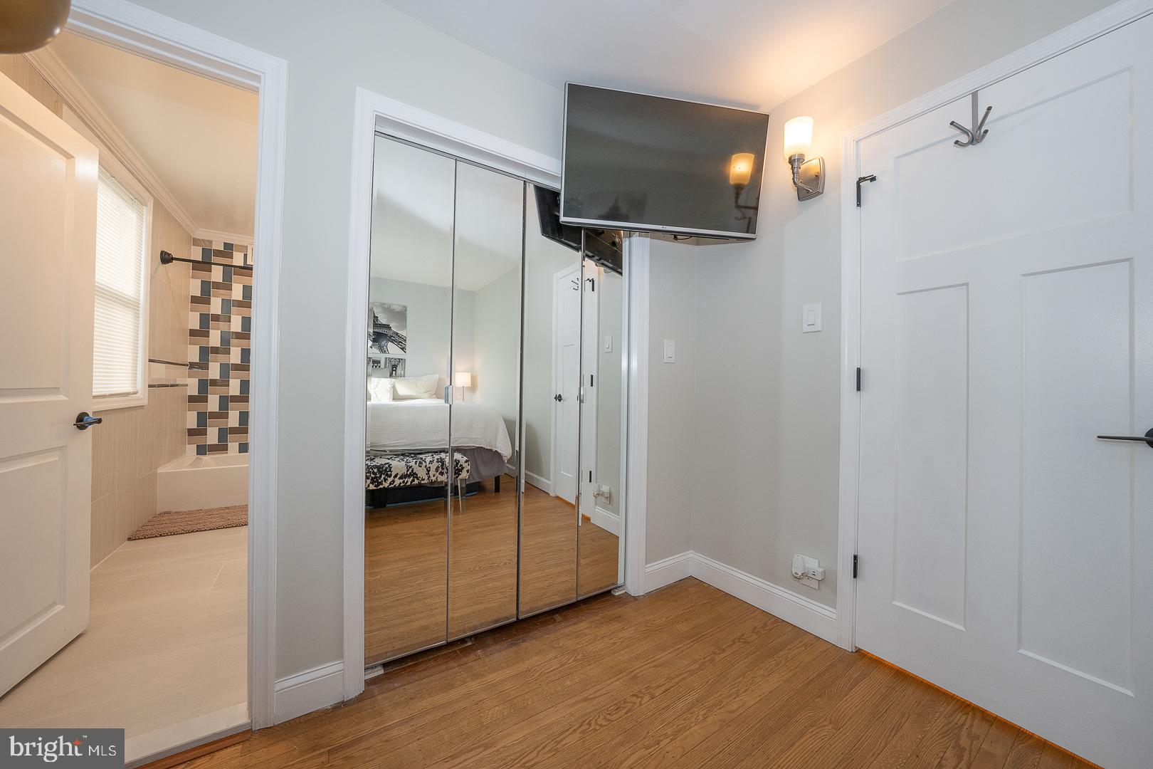 1022 Clover Hill Road Wynnewood, PA 19096 - Photo 13 of 40 a view of a room with wooden floor cabinet and a bathroom