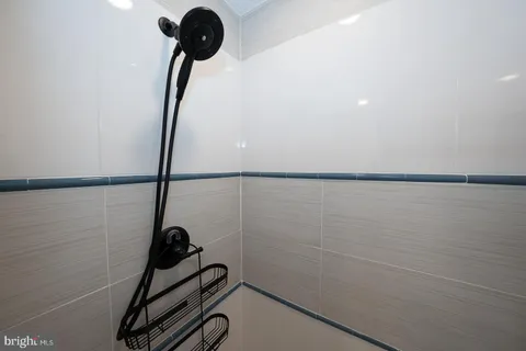 a bedroom with furniture and a wooden floor