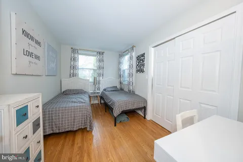 a bedroom with a bed and a table in it