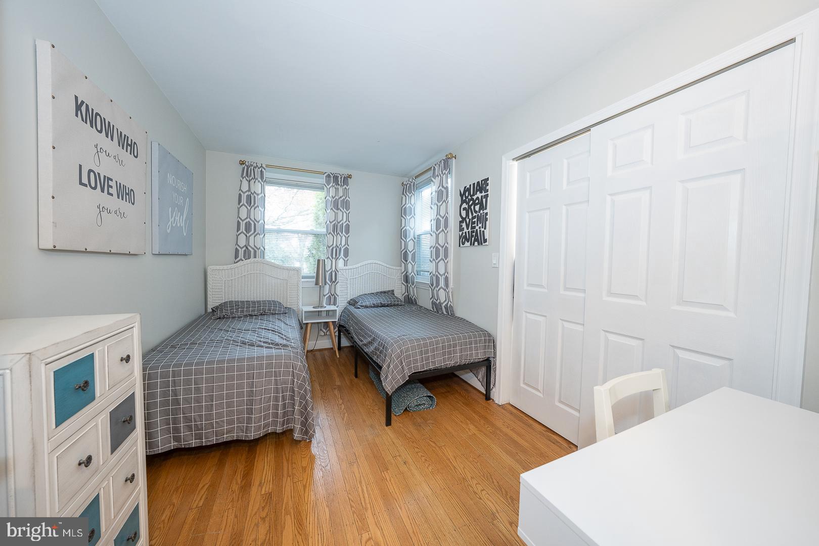1022 Clover Hill Road Wynnewood, PA 19096 - Photo 19 of 40 a bedroom with furniture and a wooden floor